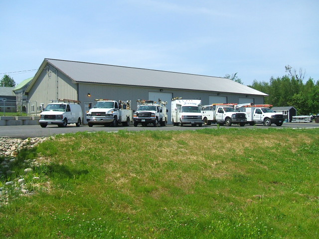 Technicians and service vehicles at work